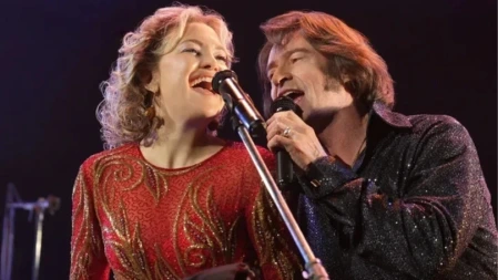 Characters sing together in a musical scene from Song Sung Blue (2025)